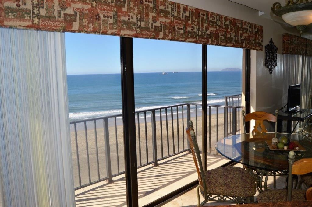 Living room with balcony and ocean view